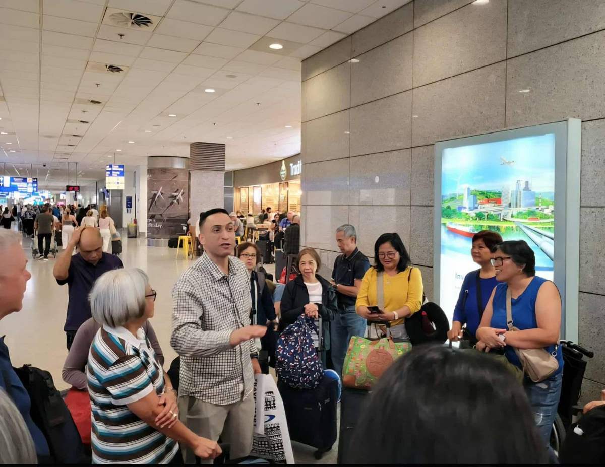Briefing the group on arrival · Airport